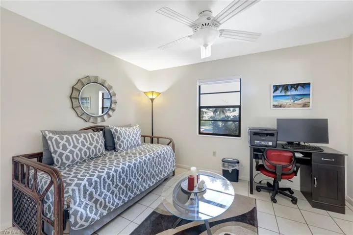Tiled bedroom with ceiling fan