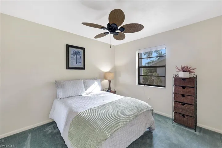 Bedroom featuring ceiling fan and carpet flooring