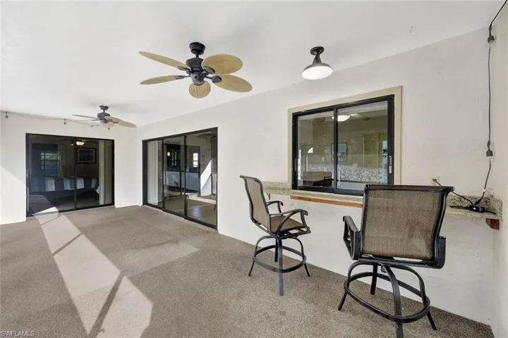 Office area featuring carpet flooring and ceiling fan