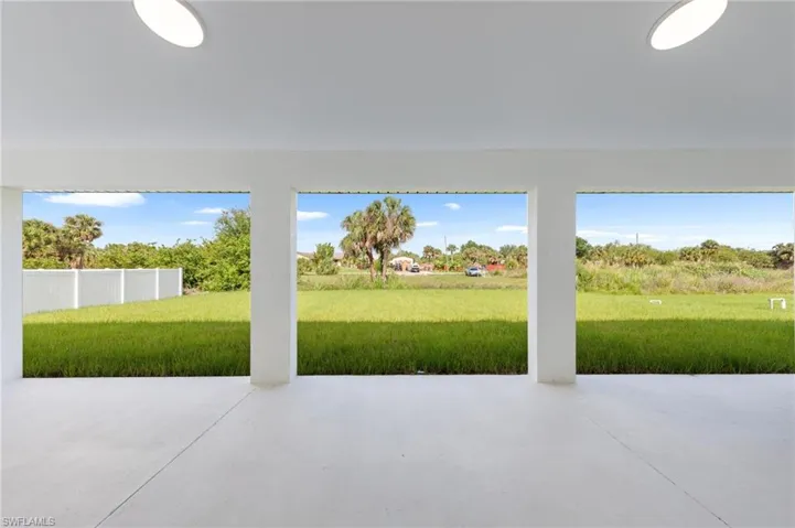Spacious covered patio with concrete flooring