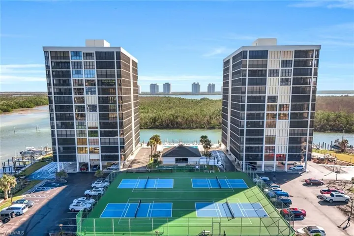 Twin high-rise residential buildings featuring private balconies and extensive water frontage