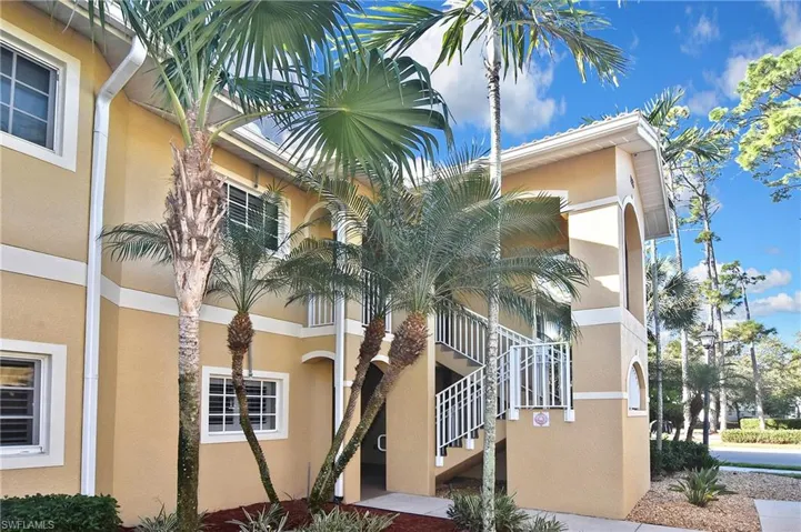 View of property with stairway