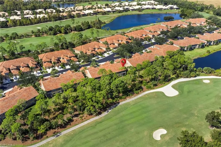Aerial view of property's location with a golf club and nearby suburban area