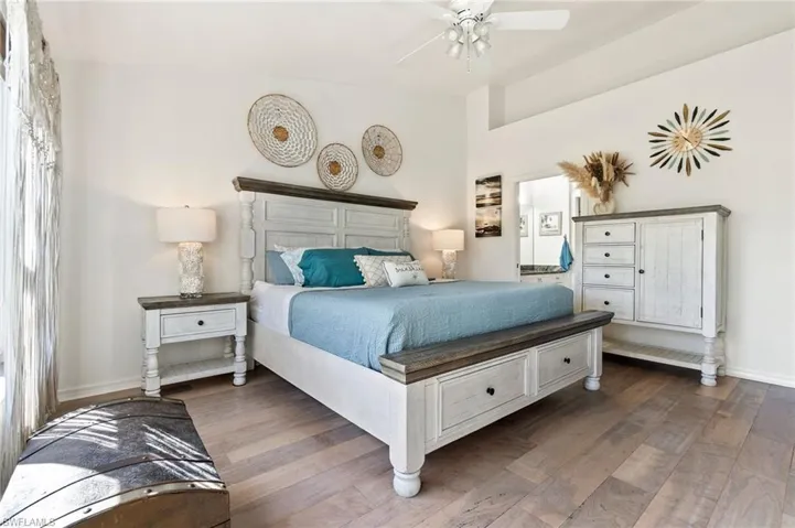 Bedroom with ceiling fan and wood finished floors