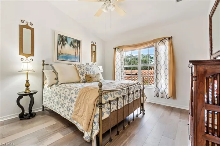 Bedroom featuring wood finished floors and a ceiling fan