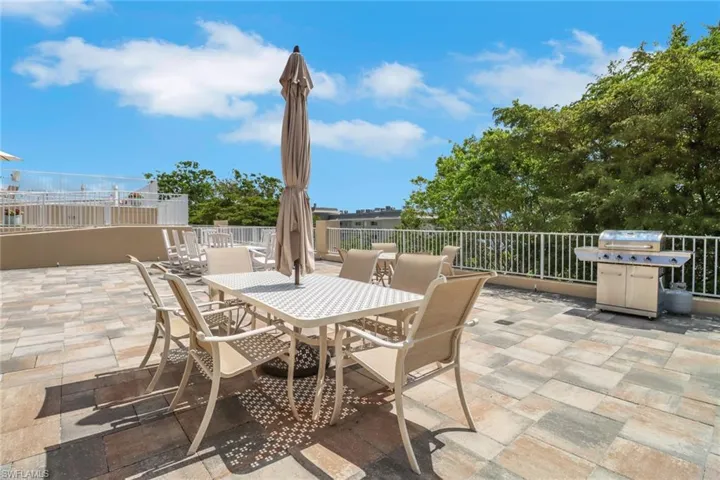 View of patio / terrace featuring outdoor dining space and a grill