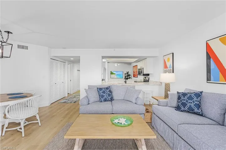 Living room with light hardwood / wood-style floors