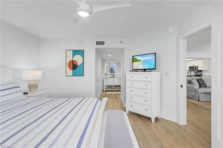 Bedroom featuring light hardwood / wood-style floors and ceiling fan