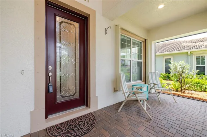 Screened in entry with pavers