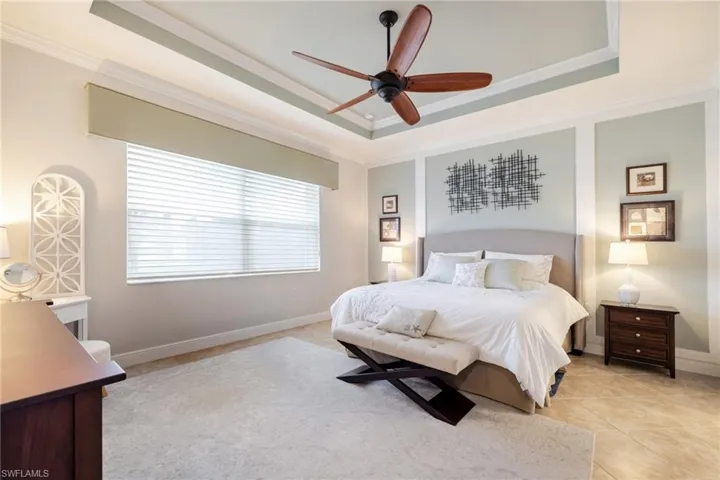 Primary bedroom with tray ceiling