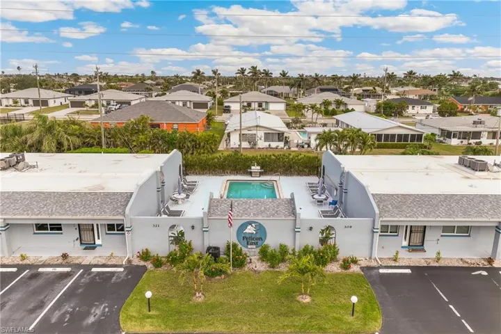 Aerial perspective of suburban area with a pool area