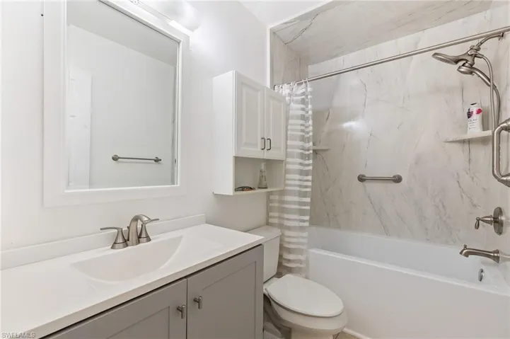 Full bathroom with vanity and shower / bath combo