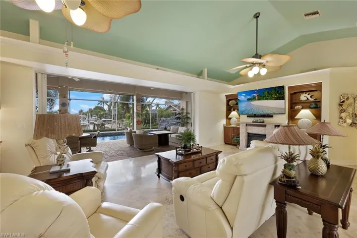 Large pocketing sliders open great room up to the Lanai, Heated Pool & Spa
