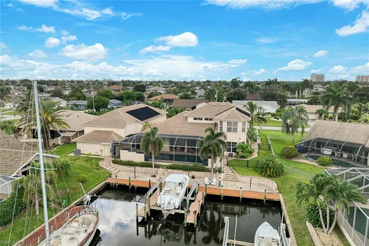 80 feet of water frontage with wrap-around dock and lift, and extended Captain's Walk.