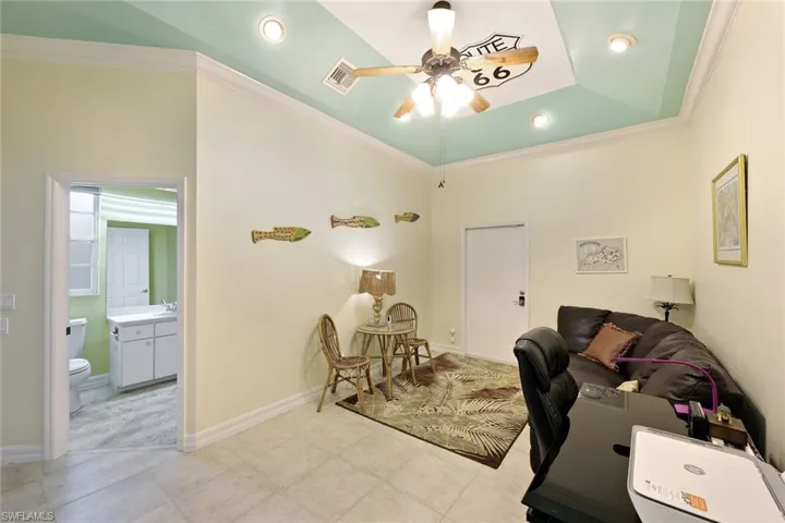 Home office with seating area, access to the RV Garage and Pool Bath