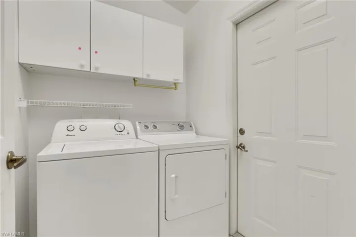 Washroom with cabinet space and independent washer and dryer