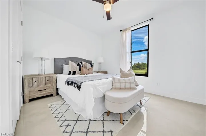 Bedroom with baseboards and a ceiling fan