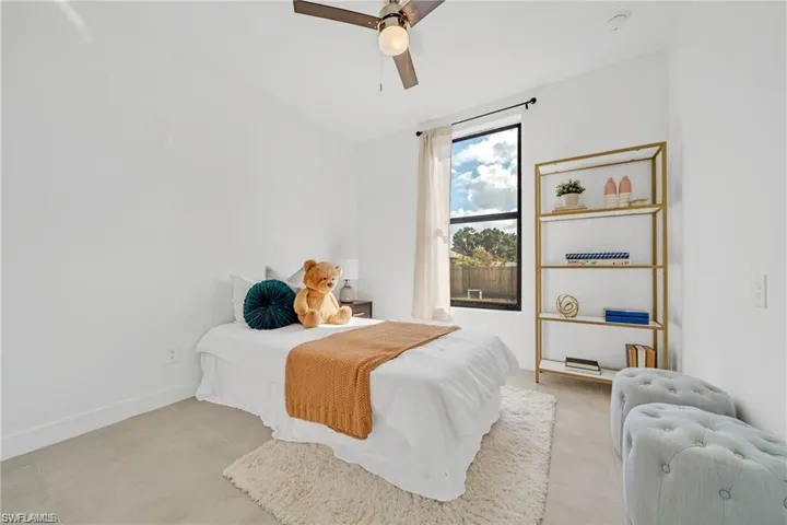 Bedroom featuring baseboards and a ceiling fan