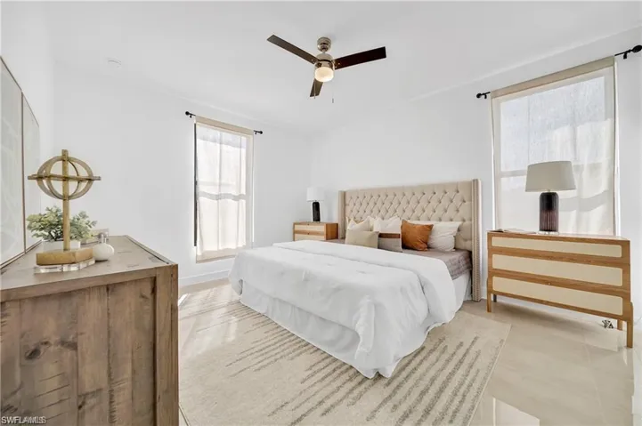 Bedroom with baseboards and a ceiling fan