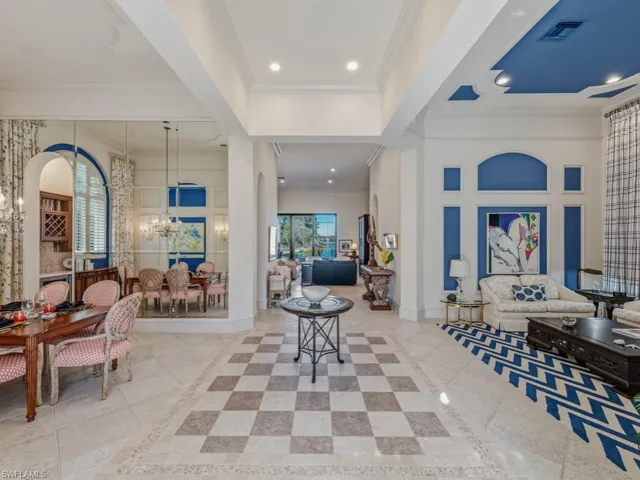 Grand Foyer with mirrored Dining Room & adjacent Formal living Room
