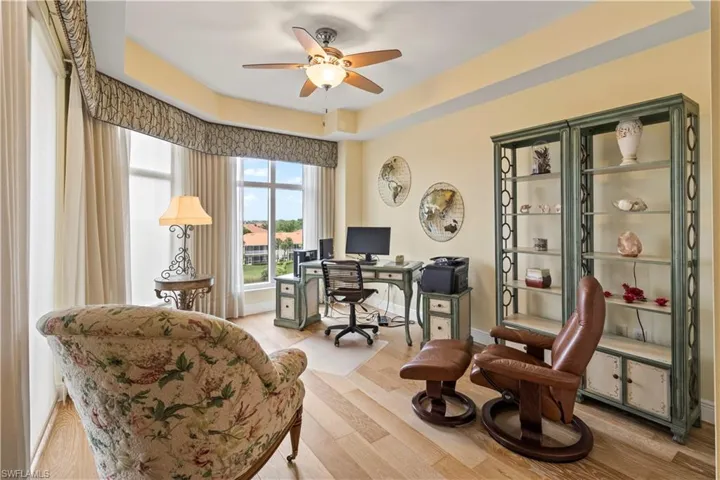 Bedroom #3 / Home office featuring a ceiling fan, light wood finished floors, and motorized blinds