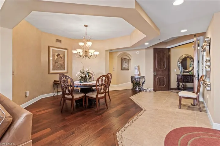 Dining room featuring recessed lighting, a chandelier, and wood-type flooring