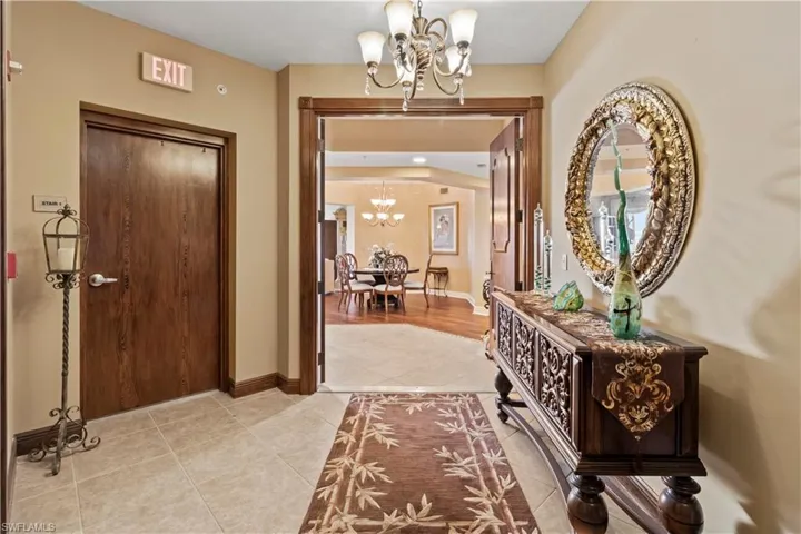 Entryway featuring a chandelier and light tile patterned floors