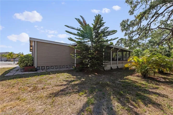View of yard with a sunroom