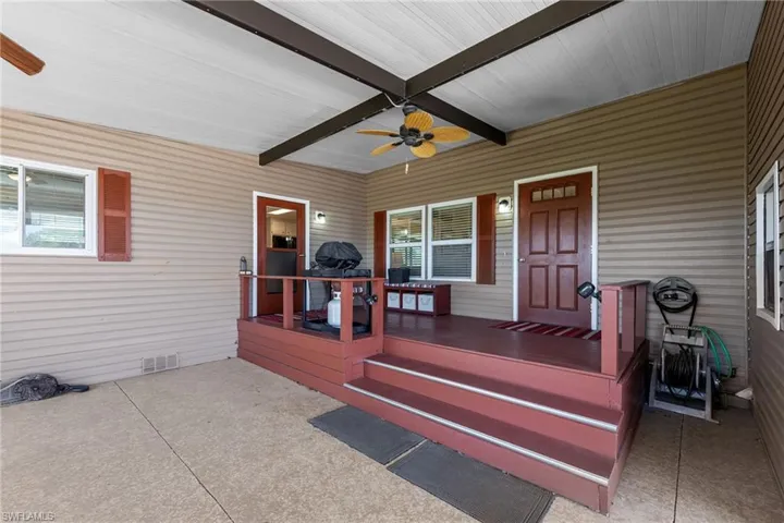 Sunroom / solarium featuring beamed ceiling and visible vents