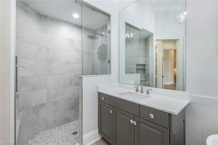 Full bathroom with vanity and walk in shower