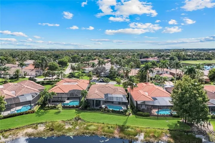 Aerial perspective of suburban area featuring a large body of water