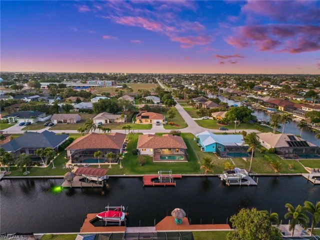 Aerial perspective of suburban area featuring a large body of water