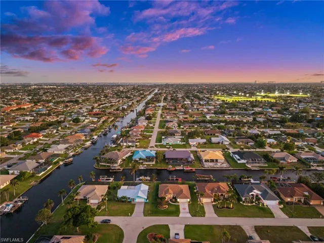 Aerial view at dusk of a residential view and a water view
