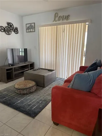 Living room featuring light tile patterned floors