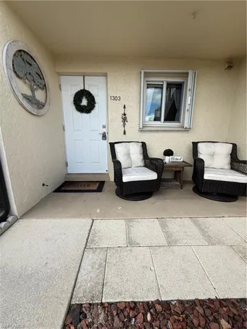 Property entrance with stucco siding