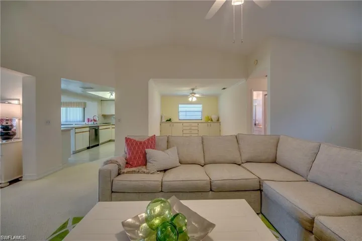 LOOKING TO DEN AND KITCHEN.
