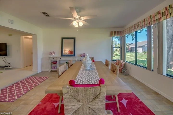 DINING AREA IN TILED FAMILY ROOM.