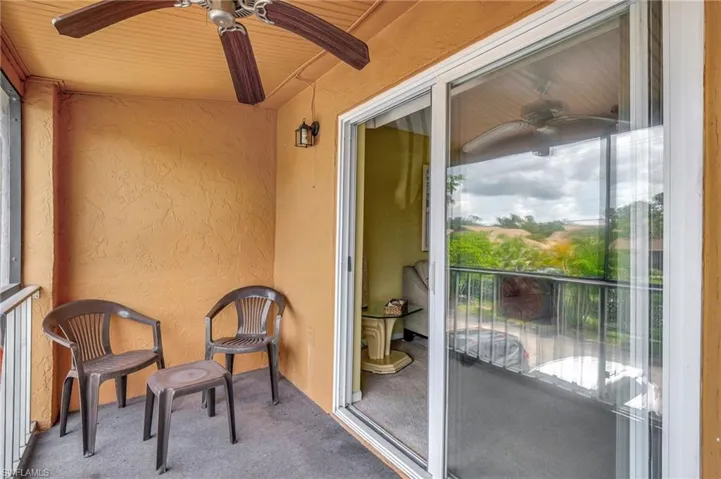 Balcony featuring ceiling fan