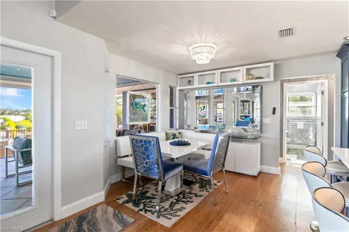 Dining area with bench seat and buffet/entertainment bar.