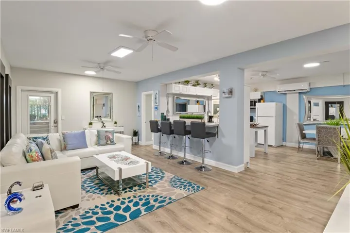 Downstairs kitchen and dining room- an open concept with tall ceiling and a very fun and flexible floor plan!