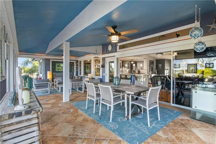 Sliding doors open to the outdoor expansive living area - a true blend of everything the best of Florida living was designed to be!