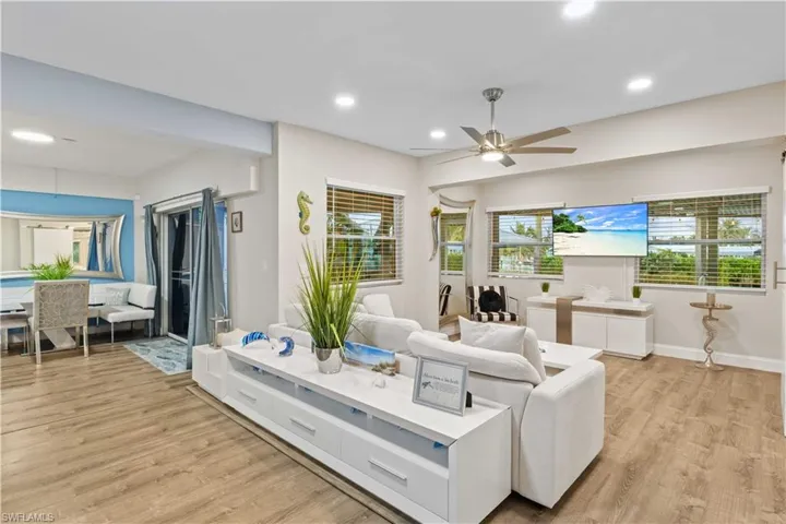 Additional living room downstairs with access to the covered outdoor patio and pool area!