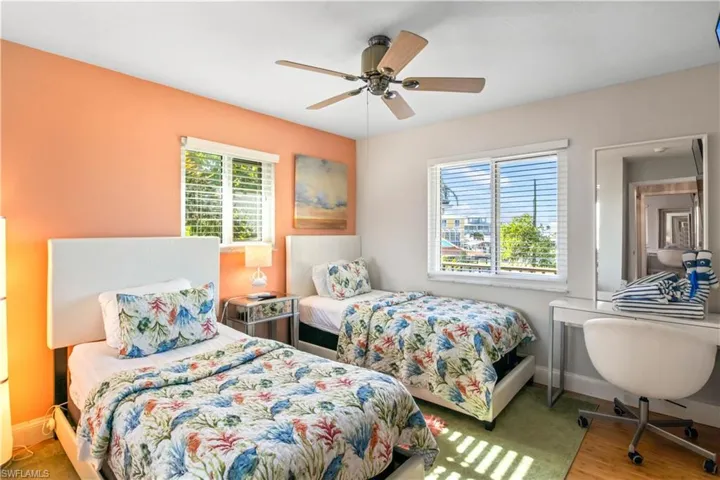 Third bedroom upstairs with twin beds and some more of that gorgeous natural light!