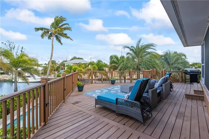 Lounge, dine, and play in your private waterfront haven surrounded by lush greenery.