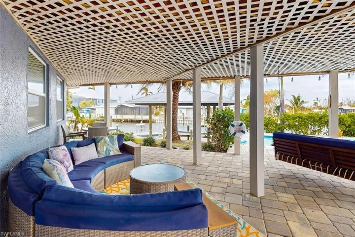 Spacious lanai, covered seating areas, and sparkling water views set the perfect backdrop for every gathering.