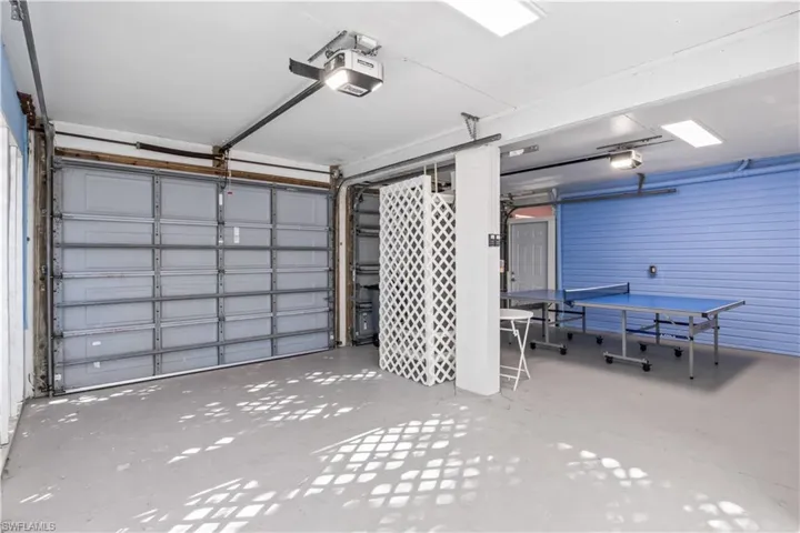 Garage with 3 cars and additional room!  Plenty of space for a golf cart or long boat!