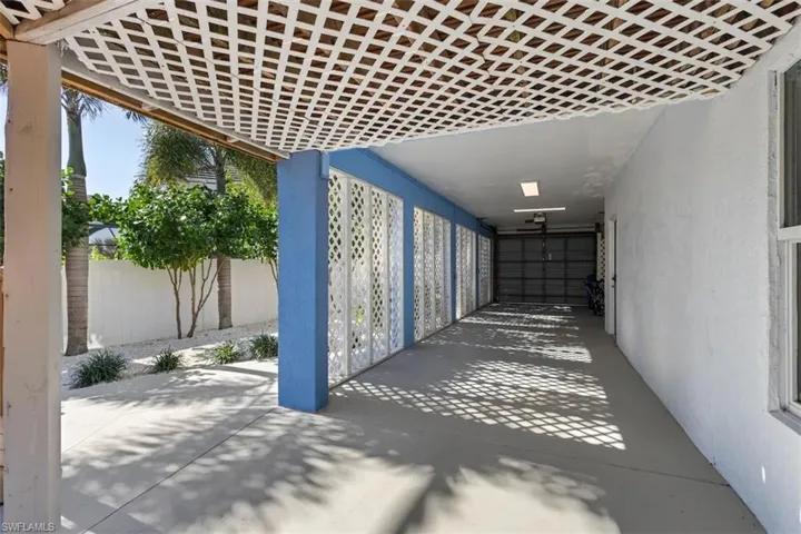 Covered side area of the home offers extra space for storage or outdoor equipment, keeping everything organized and protected from the elements.