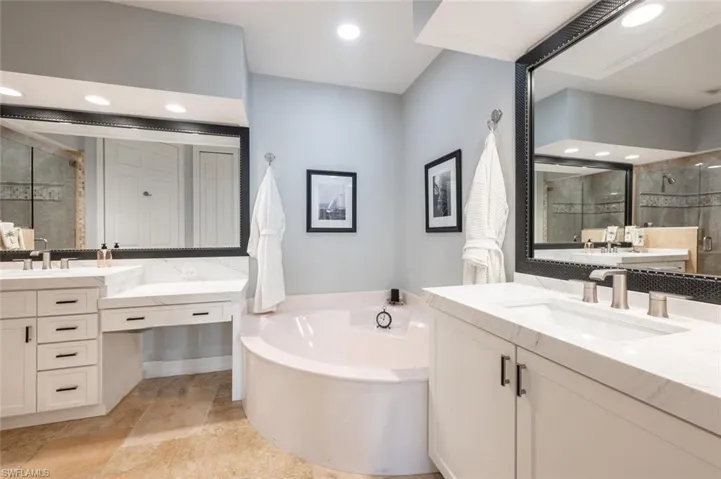 Separate double sinks, Quartz Counter Tops, new cabinetry , Custom Mirrors