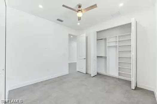 2nd Bedroom in second unit featuring a custom closet and ceiling fan