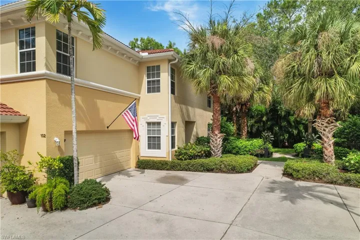 View of property exterior featuring a garage